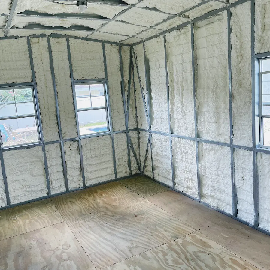 Closed-cell spray foam insulation applied to wall cavities in a residential project in Lancaster